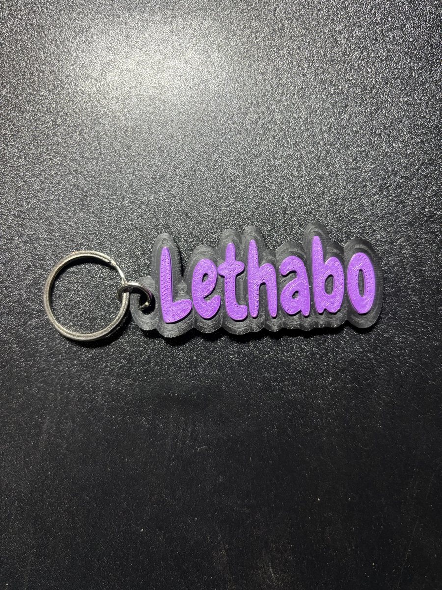 Name tag Lethabo, clear base, purple letters