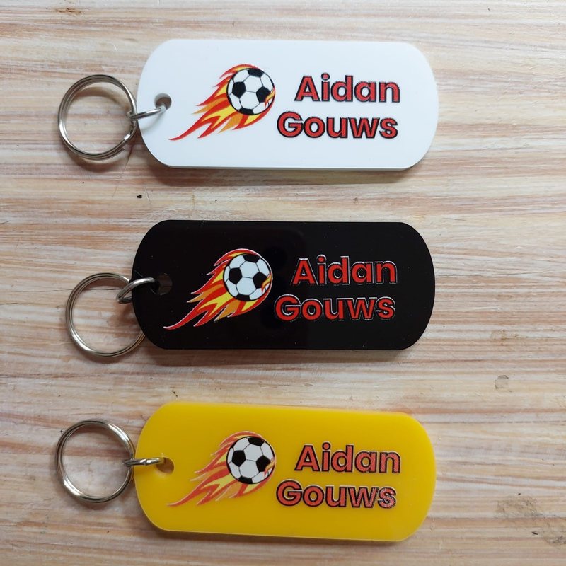 Full-colour Perspex bag tags with a soccer ball